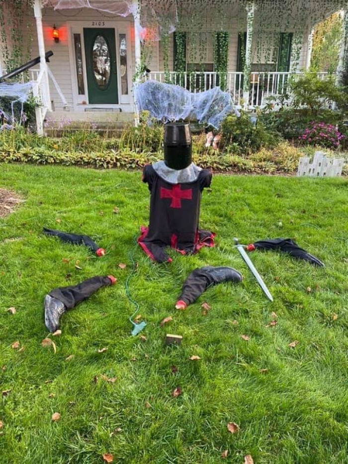 I'm not only impressed by their Halloween decorations, but I can't help but notice her hanging plants.