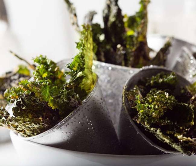 9. Kale Chips: For an added flavor boost sure to rock your taste buds, pair with parmesan cheese.