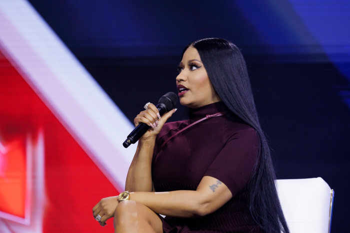 Nicki Minaj at an event, referencing backlash after deleting Instagram.