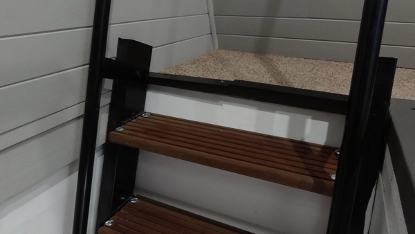 The stairs were crafted from a rich, exotic dark grain wood.