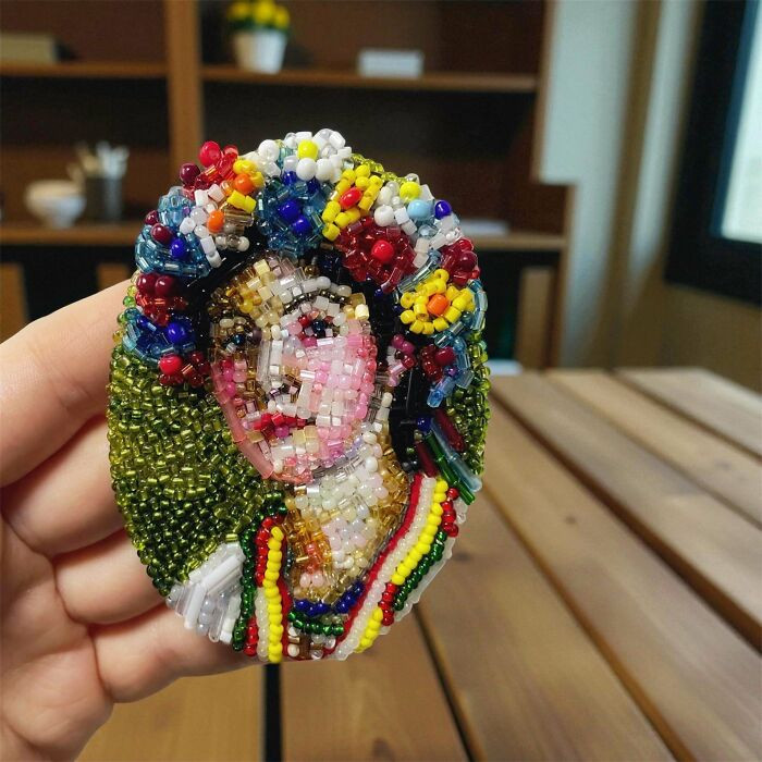 "Hand-Embroidered Beaded Portrait"