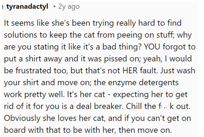 If the OP can't accept her cat, it might be best if they split up.