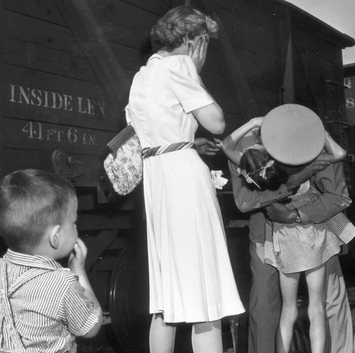 “Homecoming,” Robert Moore reunited with his family during a visit to Villisca, Iowa, after returning from service in World War II, 1943.