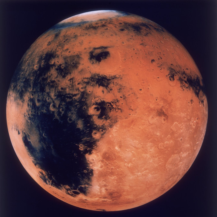 Astronaut working in microgravity, highlighting radiation risks and health challenges
