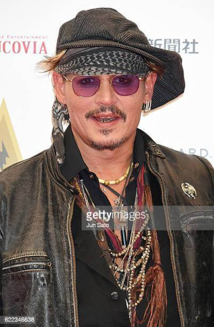 12. Since Johnny Depp's teeth are white, he tries to alter his already crooked smile.