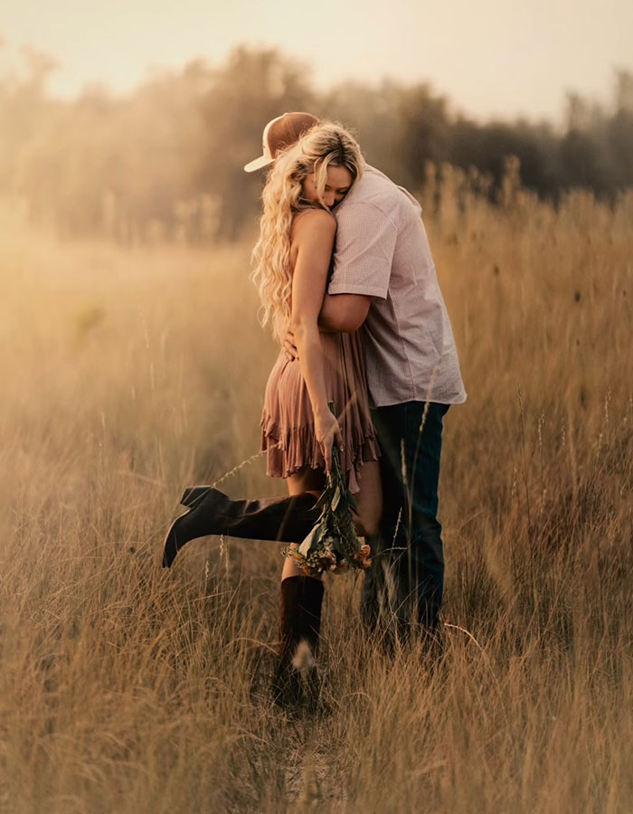 A hug that feels like home, set against the golden fields of Oregon.