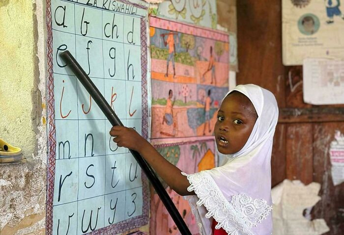 Young Lass Reading The Alphabet At Her Primary School In Zanzibar, Off The Coast Of East Africa. (Image - Nese Ari)