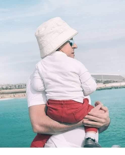 Notice how perfectly aligned the father's head is with his son's!