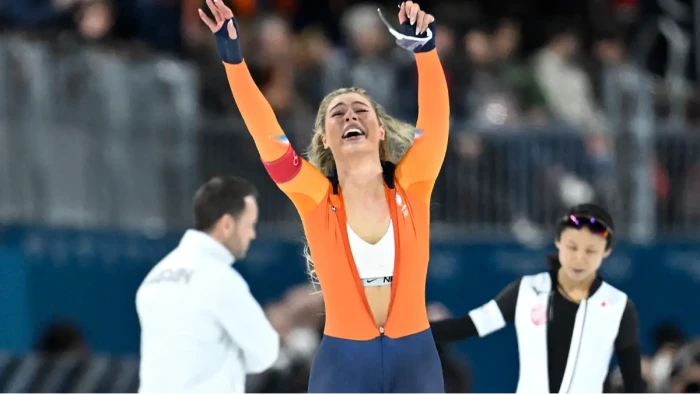 Jutta Leerdam in speed skating celebration pose, suit unzipped on Instagram