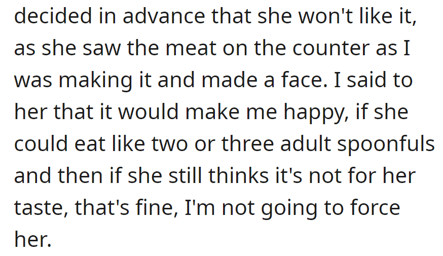 She frowned at the meat and appeared set on not liking it. OP asked her to try two or three spoonfuls, prioritizing his happiness.