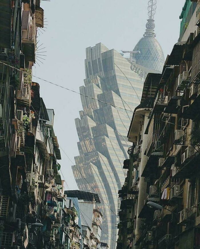 The Grand Lisboa Hotel Against The Backdrop Of Slums In Macau, China