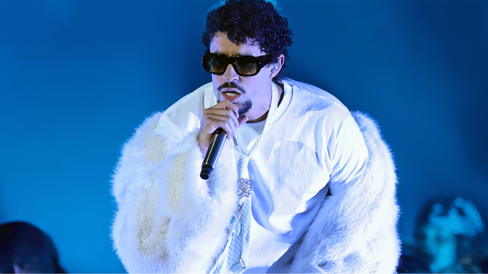 Bad Bunny at event, surrounded by supporters, amid Super Bowl halftime buzz