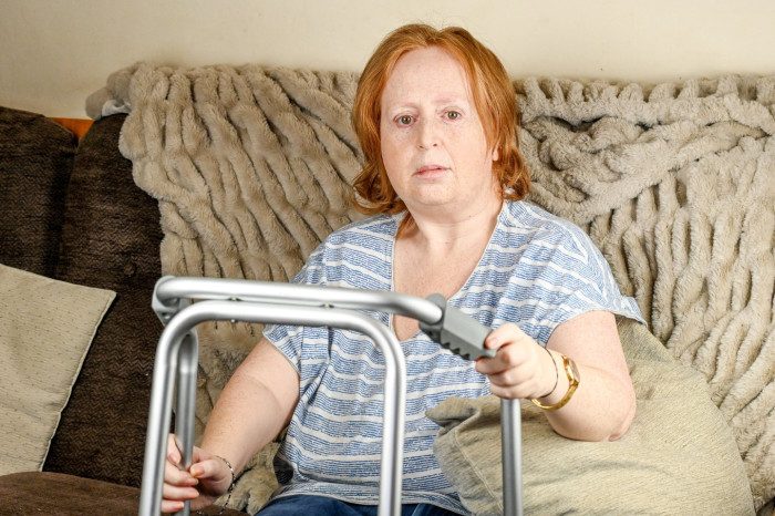 Mother holding legal documents, advocating accountability for chemotherapy misdiagnosis claims.