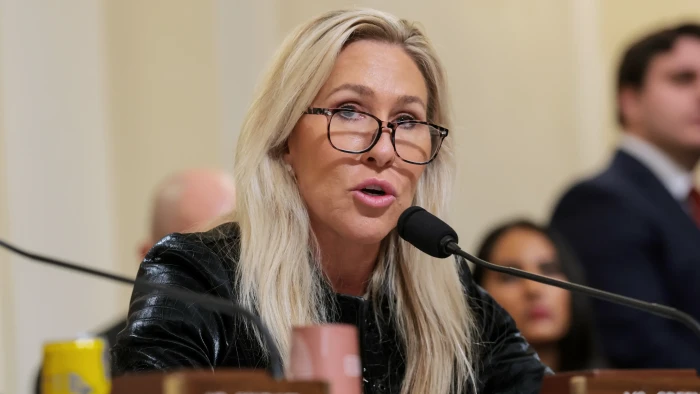 Marjorie Taylor Greene at a rally, condemning Trump and the Epstein case