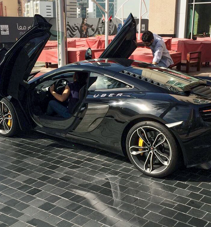 38. A Friend Sent Me This Photo From His Trip To Dubai. An Uber McLaren Picking Up Someone From A Hotel