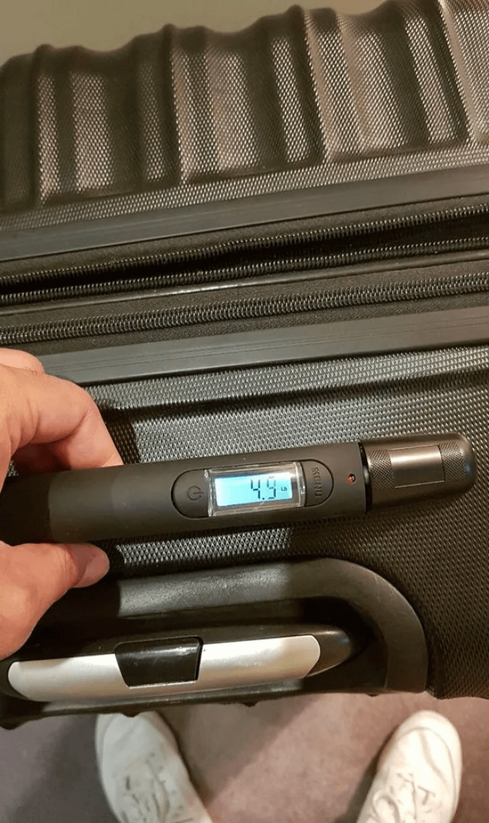 23. A suitcase that displays its own weight