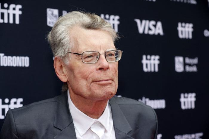 Stephen King speaking at an event, condemning ICE militarization and enforcement.