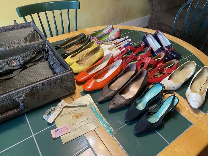 44. This suitcase full of beautiful shoes was just lying behind this house's wall for who knows how long