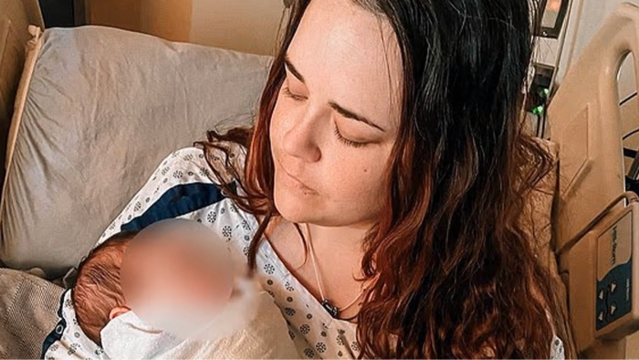 Surrogacy waiting room scene, surrogate looking contemplative amid emotional isolation